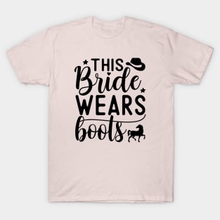 This bride wears boots | wedding; country; country girl; cowgirl; horse rider; horses; hen; bachelorette; party; hen's party; bride gift; bridal shower; getting married; T-Shirt